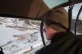 Thumbnail image of Aran Johnson keeps a sharp eye on the landscape below for elk herds.