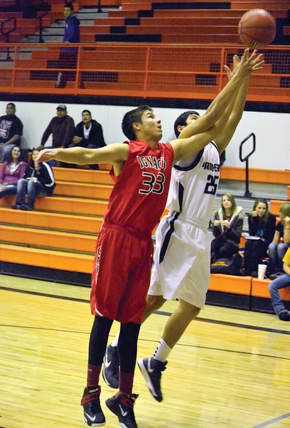 Ignacio sophomore Adison Jones (33) fights with 4A Farmington, N.M.