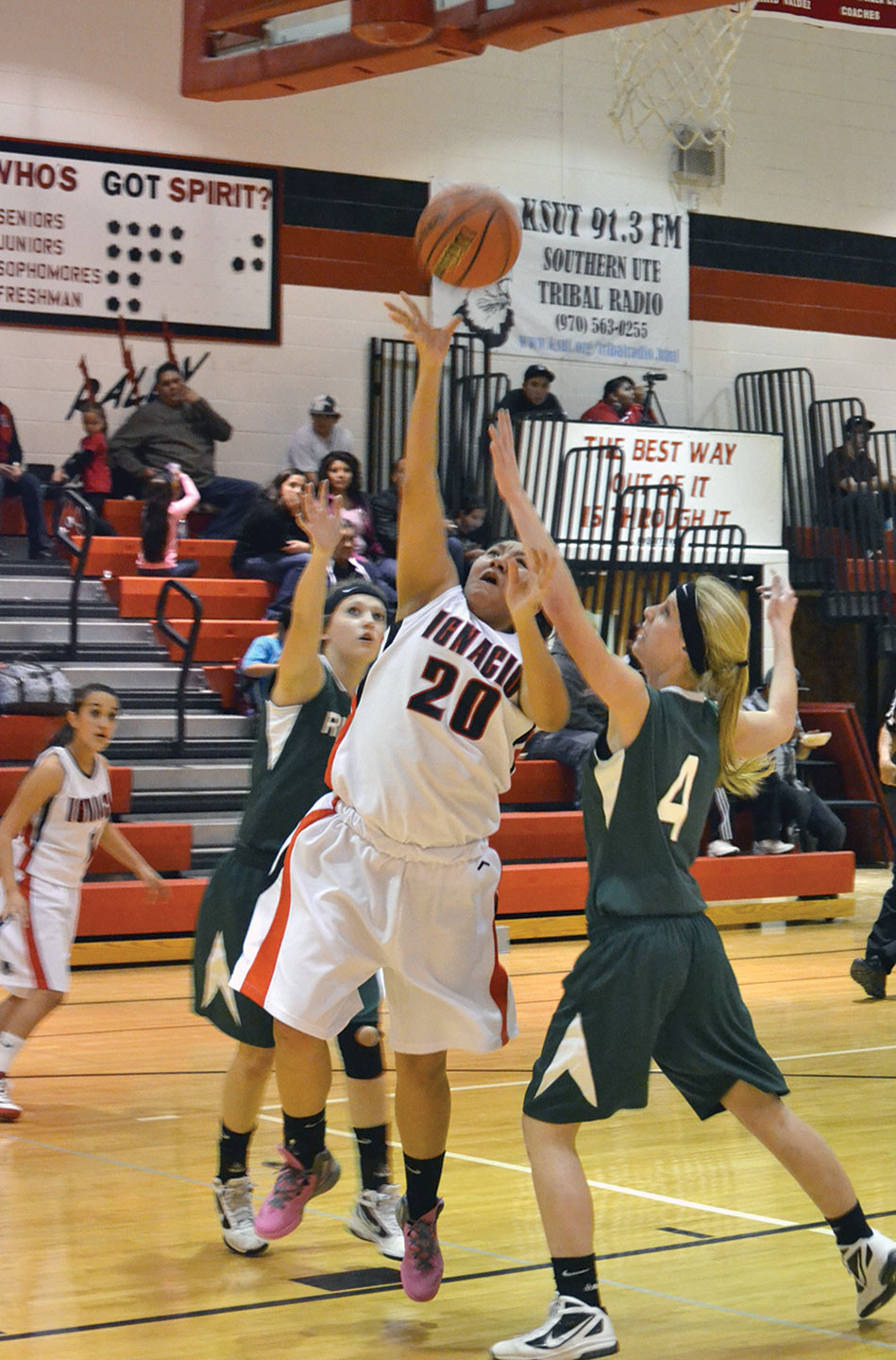 Ignacio senior Valerie Armstrong (20) splits two Ridgway defenders.