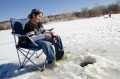 Thumbnail image of Dustin Sanchez takes in the afternoon with a close watch on his line.