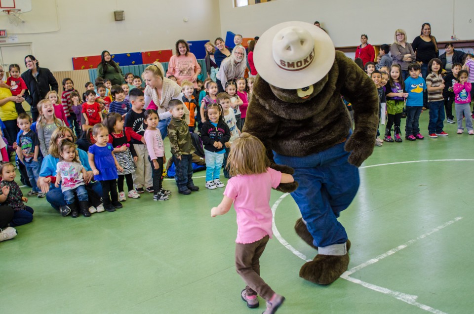 Smokey Bear dances a bluegrass jig