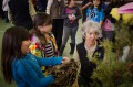 Thumbnail image of Kids touch toy versions of wild animals during the educational portion of the presentation