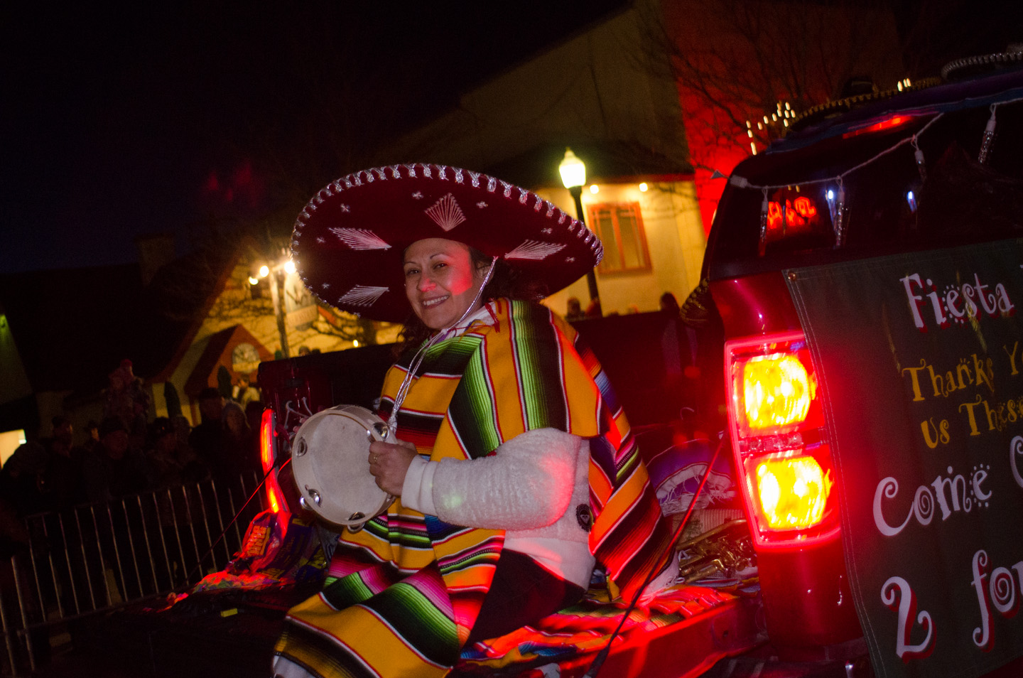 Sombrero and poncho help to keep a woman warm.