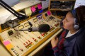Thumbnail image of Southern Ute Tribal Radio Music Director Lorena Cibrian works from the KSUT studios