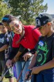 Thumbnail image of Emily McDonald gives instruction on Wednesday, April 3 to a group of aspiring young golfers during the weeklong Spring Break Golf Clinic of the Boys & Girls Club of the Southern Ute Indian Tribe at Hillcrest Golf Course in Durango.