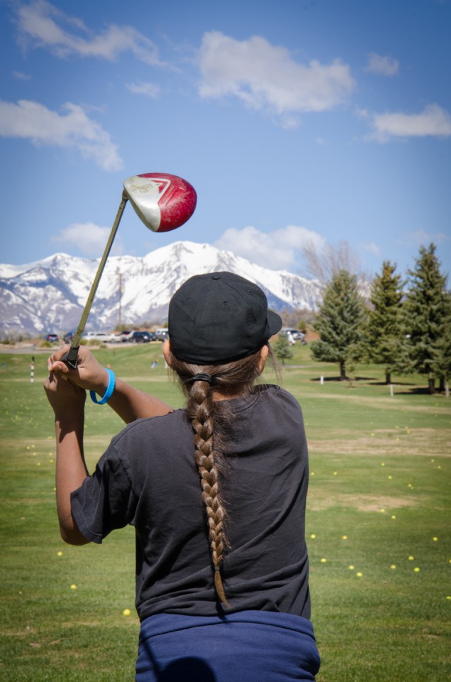 Sie Chakee hits practice balls on Hillcrest’s driving range with the La Plata Mountains shimmering with fresh snow in the distance.