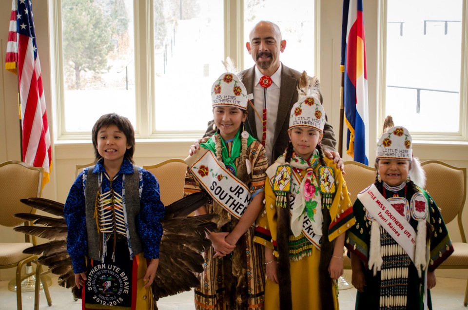 Lt. Gov. Joe Garcia poses for a photo with Southern Ute Royalty members (left to right) Cyrus Naranjo, Brave; Jazmin Carmenoros, Jr. Miss Southern Ute; Yllana Howe, Little Miss Southern Ute; and Tauri Raines, Little Miss Southern Ute alternate