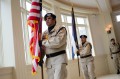 Thumbnail image of Opening the Colorado Commission of Indian Affairs meeting at the governor’s mansion, the Ute Mountain Casino Veterans Color Guard posts the flags.