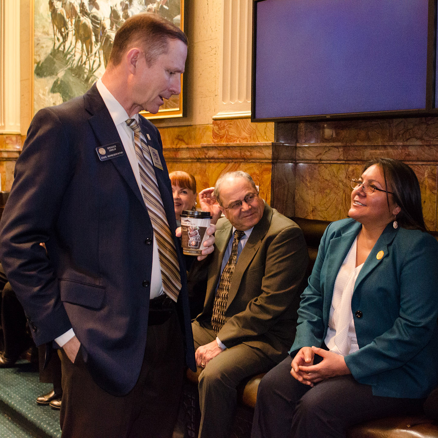 Southern Ute Council Lady Pathimi Goddtracks converses with state Rep. Spencer Swalm, R-Centennial, and Ignacio School District Superintendent Rocco Fuschetto prior to the morning welcome in the state Capitol