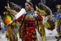 Thumbnail image of Jingle dress, fancy shawl and traditional dance styles are among those performed by the many women who danced at the spring powwow