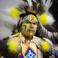 Thumbnail image of A dancer from Lame Deer, Mont., readies himself for dance.
