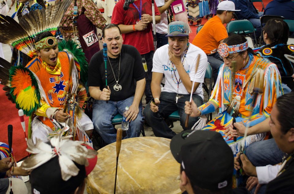 Dancers play double duty, sitting in on one of the many drums that resounded throughout the weekend-long powwow