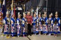 Thumbnail image of Southern Ute elder Kenny Frost stands for a portrait with the Native American Women Warrior group