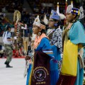 Thumbnail image of Jasmine Carmenoros and Tauri Raines proudly represent the tribe as royalty from across Indian Country make a circle through the arena