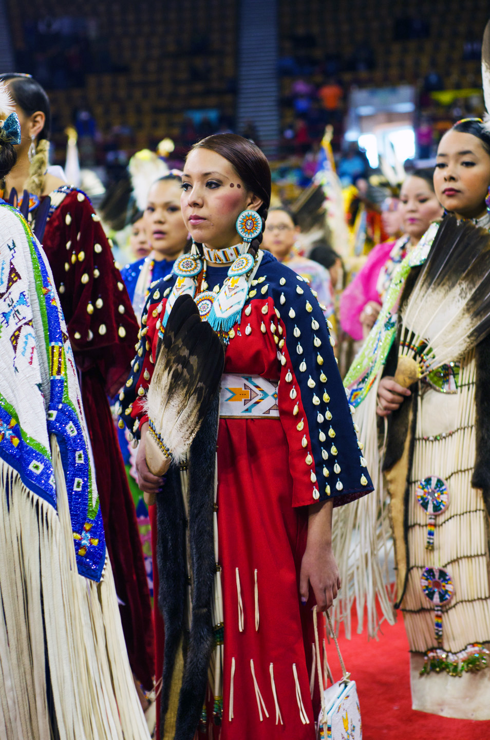 Southern Ute tribal member Brianna Goodtracks-Alires adorns a shell dress during a grand entry.