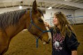 Thumbnail image of Isabella Torres familiarizes herself with a friendly and gentle horse named Rocky.