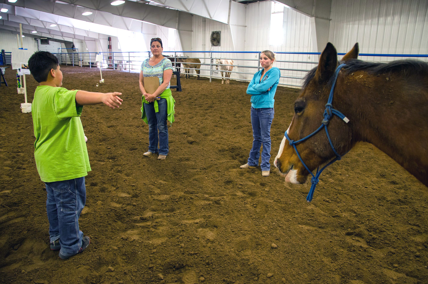 Alonso Dominguez uses his hands to signal during an exercise focusing on nonverbal communication, which helped students and mentors test their persistence and observation as a team.