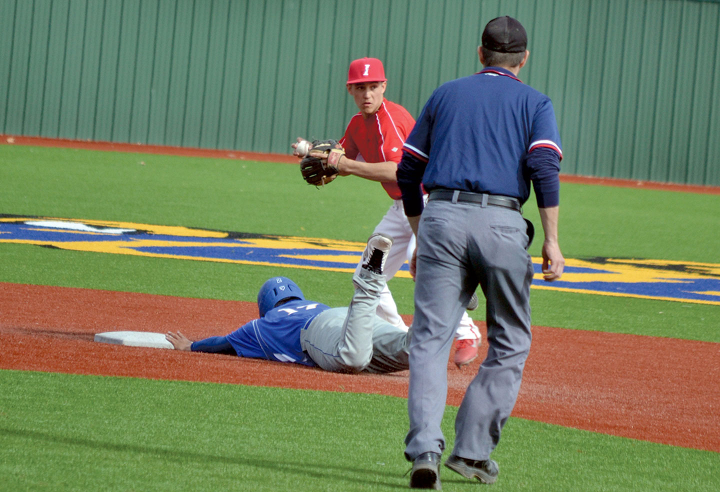 Ignacio shortstop Iaasic Pena looks to finish a double play