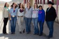 Thumbnail image of Judging participants stand for a group photo at the Southern Ute Fairgrounds