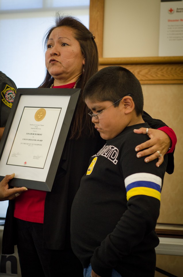 Lisa Burch Frost stands beside her grandson, Ethan Rock, following a recognition ceremony honoring those who worked together and helped to save his life last July.