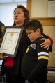 Thumbnail image of Lisa Burch Frost stands beside her grandson, Ethan Rock, following a recognition ceremony honoring those who worked together and helped to save his life last July.