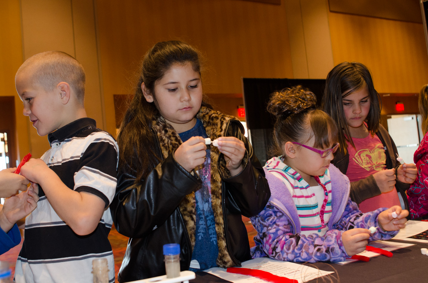 Grace Gonzales participates in the cultural fair alongside her classmates.