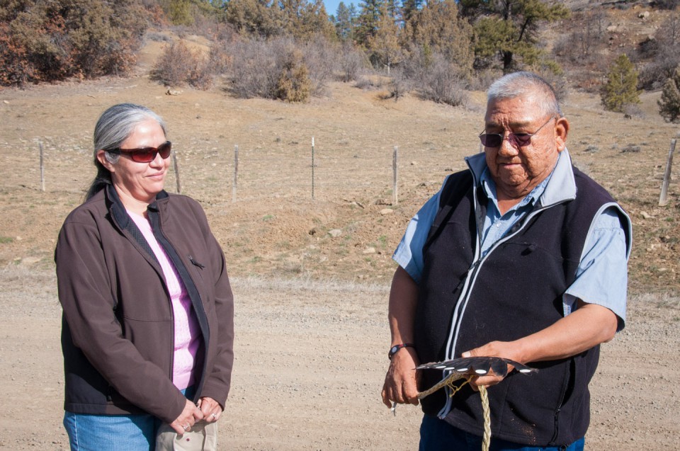 Lena Atencio (left), director of the Southern Ute Department of Natural Resources, chats with tribal elder Elwood Kent following a blessing near the site where the department is working to round up feral horses.