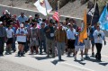 Thumbnail image of Tribal flags of the Ute tribes lead the way