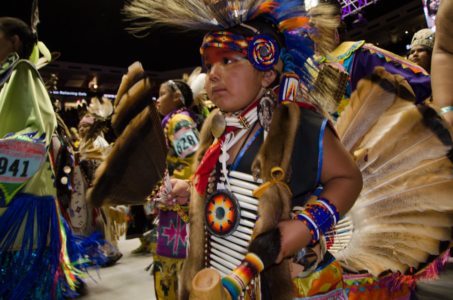 Young dancers make their way into the arena during intertribal dance.