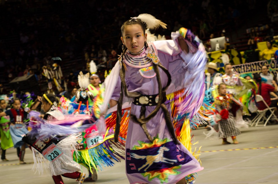 Young Southern Ute tribal member Avaleena Nanaeto is a whirl of color during a dance at the University of New Mexico