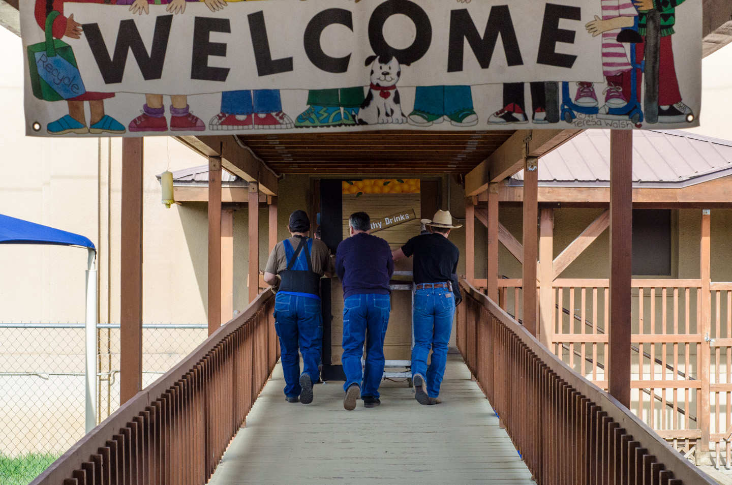 A crew wheels a new healthy snack vending machine into the Southern Ute Montessori Head Start. The machine will offer alternatives to a soda machine that was recently removed.
