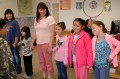 Thumbnail image of Young girls line up in their classroom to Bear Dance.