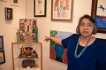 Thumbnail image of Southern Ute tribal member Arlene Millich explains some of the art on display at the Spirit of Women Art Show at the Dancing Spirit Community Arts Center in downtown Ignacio on Friday, May 3. The show featured artwork by several tribal members, including elder Annabelle Eagle. The artwork will be on display through May 30.