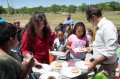 Thumbnail image of The club members line up in anticipation of food.