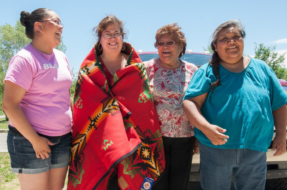 Pictured (left to right): Program Specialist Augusta Burch, Rocha, Council Lady Ramona Y. Eagle and board member Hilda Burch pose for a photo after presenting Rocha with a Pendleton blanket.