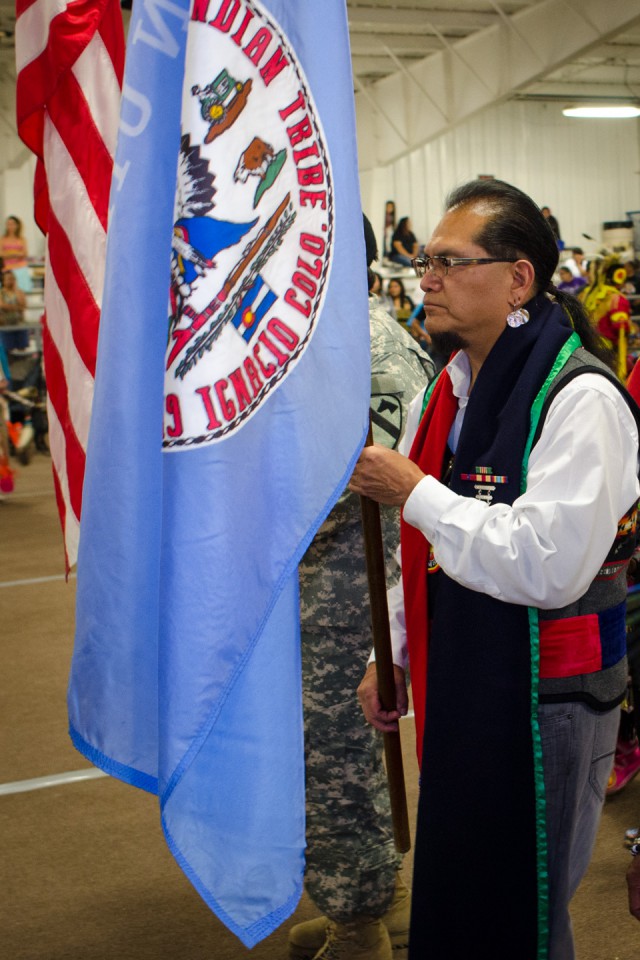 Southern Ute veteran Jack Frost Jr. carries in the Southern Ute colors during Bear Dance Powwow on Friday, May 24 at the Sky Ute Fairgrounds.