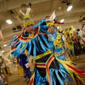 Thumbnail image of A young dancer gives an energetic display as he makes his way into the powwow arena.