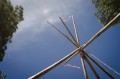 Thumbnail image of Tipi poles set the frame work for one of the many cultural activities at the weeklong summer youth camp.