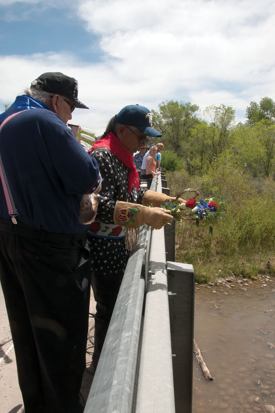 Russell Box drops a wreath into the Pine River