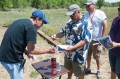 Thumbnail image of Southern Ute Indian Tribal Councilman Aaron V. Torres distributes playing cards