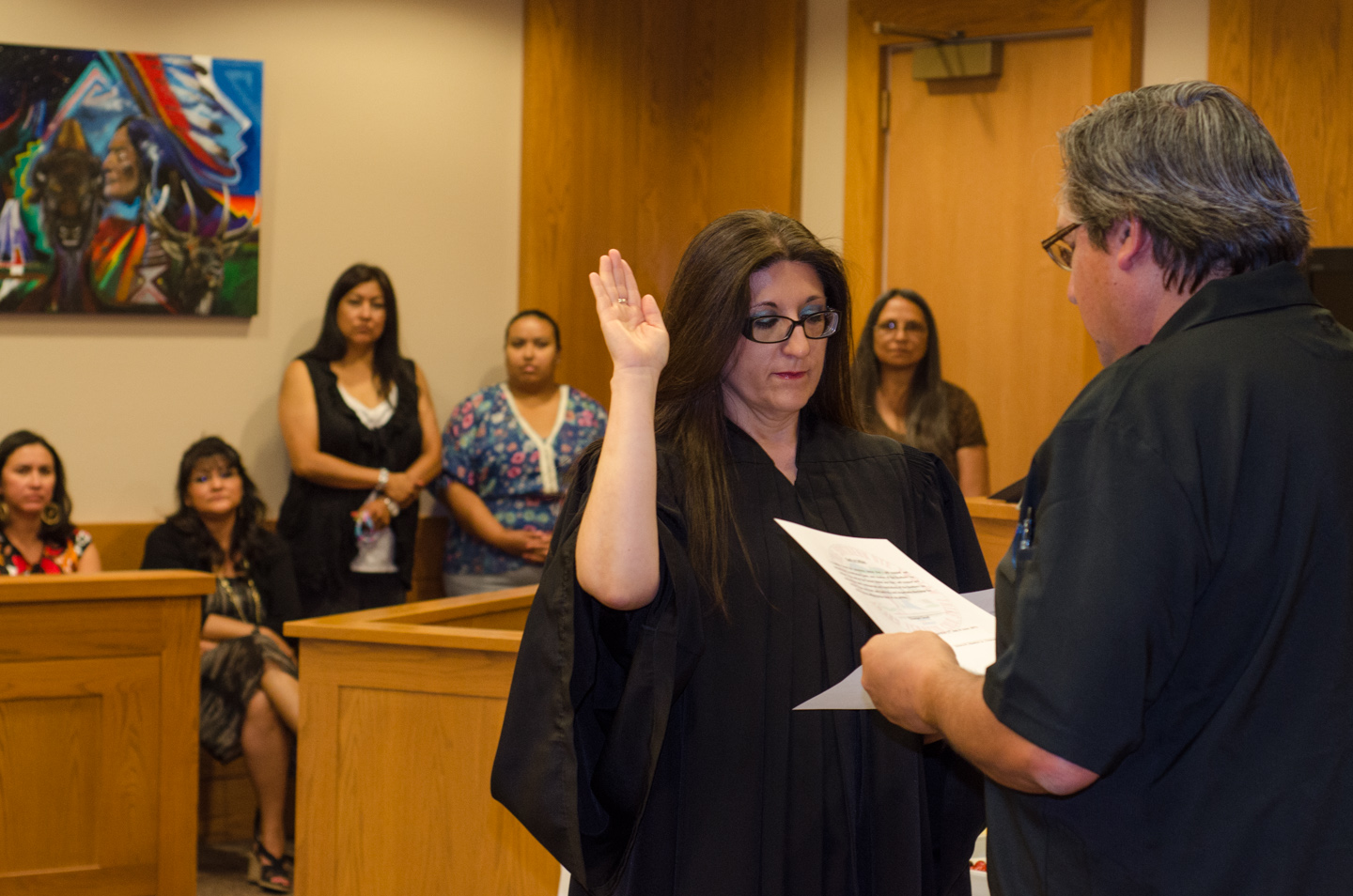 Chantelle Cloud is sworn in as chief judge of the Southern Ute Tribal Court on Monday, June 17. Southern Ute Indian Tribal Council Vice Chairman James M. Olguin administered the oath, witnessed by members of the council, the court and the Cloud family.