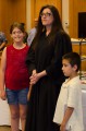 Thumbnail image of Judge Cloud stands with her family during the reception.
