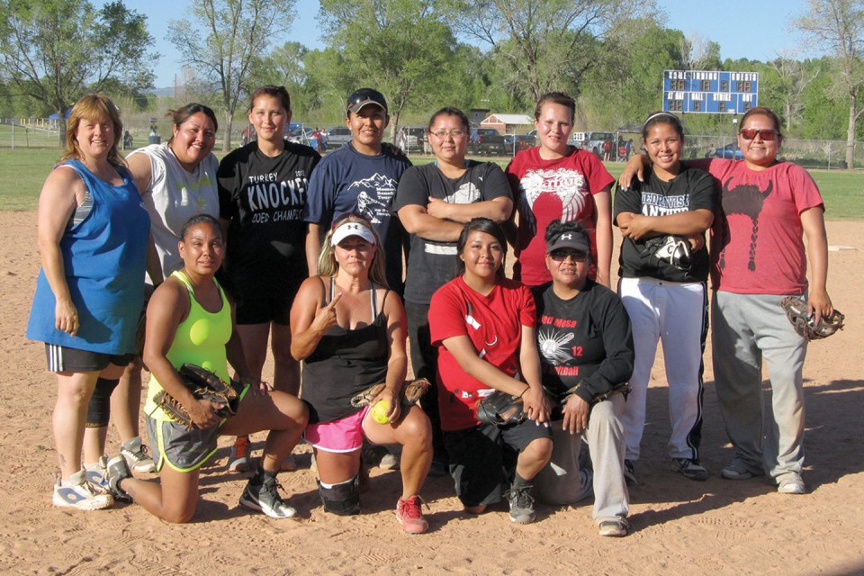 The Lady Stealth of Farmington, N.M., pose after prevailing in the women's bracket