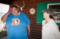 Thumbnail image of Southern Ute Chairman Jimmy R. Newton Jr. talks with Winterfawn Rey, caretaker of the Redding Ranch property for the past several years, on the porch of the ranch’s cabin on Monday, May 20.