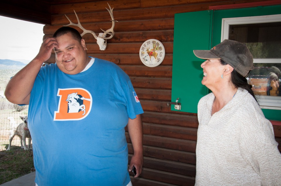 Southern Ute Chairman Jimmy R. Newton Jr. talks with Winterfawn Rey, caretaker of the Redding Ranch property for the past several years, on the porch of the ranch’s cabin on Monday, May 20.