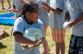 Thumbnail image of One particularly challenging race involved students handing a balloon covered in shaving cream to each other.