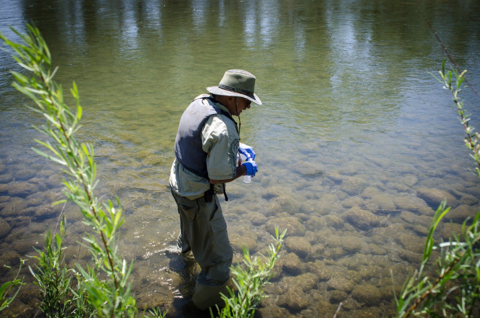 Kirk Lashmett, senior water quality specialist for the Southern Ute Indian Tribe’s Water Quality Program, collects samples from the Animas River north of the Florida River confluence for laboratory testing.