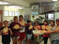 Thumbnail image of Participants show off their cooking skills by making traditional frybread during one of the many cultural activities.