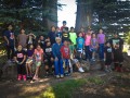 Thumbnail image of Culture Camp participants stand with Southern Ute elder Alden Naranjo for a group portrait.