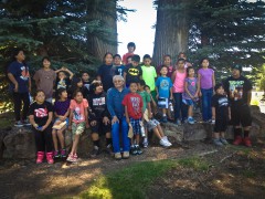 Culture Camp participants stand with Southern Ute elder Alden Naranjo for a group portrait.